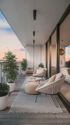 a balcony with chairs, tables and potted plants