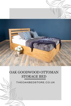 oak wood ottoman storage bed with headboard, foot board and foot board in front of blue wall