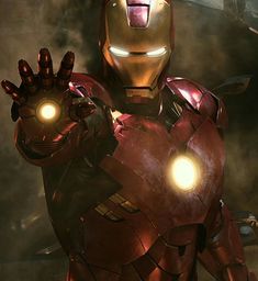 an iron man standing in front of a dark background