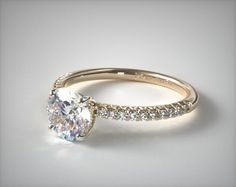 an oval cut diamond engagement ring with side stones