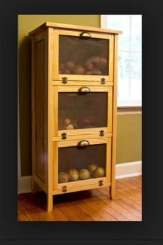 a wooden cabinet with two glass doors and drawers