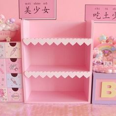 there is a pink shelf in the room