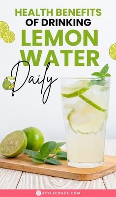 lemon water in a glass with limes around it and the words health benefits of drinking lemon water day