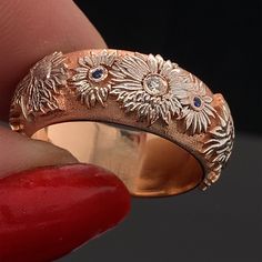 This custom made sunflower ring with diamond and sapphire accents will never go out of fashion. It's timeless elegance in the purest form. This beautiful creation measures 8mm in width. The profile of the ring is domed. The ring is designed with a Comfort Fit interior. This handcrafted wedding ring is unisex and can make a perfect Wedding band, Anniversary Ring or Promise Ring. The ring can not be resized after it is made. Please confirm your finger size with a local jeweler before placing the o Anniversary Rings With Sunflower Design, Sunflower Wedding Ring, Sunflower Jewellery, Sunflower Wedding Rings, Sunflower Ring, Sunflower Wedding, Personalized Anniversary, Natural Sapphire, Anniversary Ring