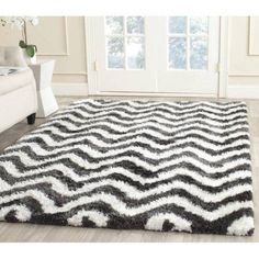 a black and white area rug in a living room