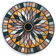 a circular stained glass window with an abstract design