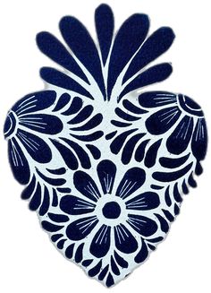 a blue and white heart shaped object on a white background with an intricate design in the center