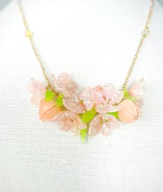 Embrace the beauty of blossoms with our Handmade Shrink Plastic Peach Flower Necklace! Carefully crafted, this stunning piece captures the essence of delicate peach blossoms in a wearable form. The lightweight and durable shrink plastic pendant ensure comfort, while the intricate details showcase the artistry behind each piece. Perfect for nature lovers and those who appreciate handmade jewelry, this unique necklace adds a touch of elegance to any outfit. Ideal as a thoughtful gift, this Peach Flower Necklace is a symbol of beauty and creativity, bringing the charm of spring wherever you go. Elevate your style with this handmade accessory, a true celebration of nature's grace and craftsmanship! Shrink Plastic Necklace, Spring Flower Jewelry With 3d Flowers, Feminine Blossom Jewelry For Spring, Whimsical Spring Jewelry Gift, Blossom Flower Jewelry For Spring, Spring Jewelry With 3d Flowers, Spring Blossom Jewelry With Flower Decoration, Delicate Spring Jewelry With 3d Flowers, Spring Flower-shaped Rose Gold Necklaces