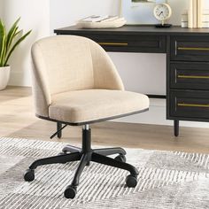 an office chair sitting on top of a rug in front of a desk with a clock