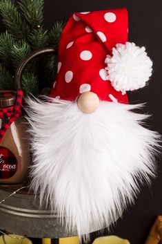 a santa gnome hat sitting on top of a tin can