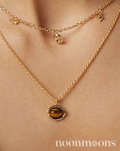 Elegance Meets Healing: Dainty Gold-Plated Tiger's Eye Charm Choker Necklace ☽ Embrace subtle sophistication with this s925 sterling silver gold-plated choker necklace, featuring a delicate tiger's eye charm stone. The charm is beautifully bezel-set and adds a touch of natural allure to the dainty charm necklace. This charm necklace pendant not only enhances your style but also serves as a healing necklace, believed to bring strength and balance. As the November birthstone, tiger's eye adds a meaningful touch, making it a perfect gift or personal keepsake. Whether you're dressing up for a special occasion or adding a chic touch to everyday wear, this charm necklace chain offers a blend of elegance and personal significance. ♥︎  DETAILS: ☽ Material: 18k Gold-plated S925 Sterling Silver, Tig Dainty Everyday Charm Necklaces, Silver Gold Plated Necklace, Luxury Minimalist Gold Plated Charm Necklace, Cheap Yellow Gold Clavicle Chain Charm Necklace, Luxury Minimalist Yellow Gold Charm Necklace, Gold-tone Gold Plated Round Charm Necklace, Gold Gemstone Round Chain Necklace, Gold Gemstone Chain Necklace, Gold Gemstone Chain Necklace Fine Jewelry