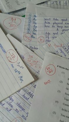 lots of papers with writing on them and numbers written in red, white and blue