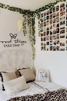 there is a bed with pictures on the wall above it and an animal print comforter