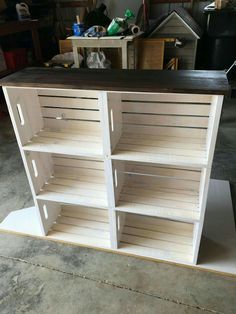 the shelves are made out of plywood and have been painted white with black top