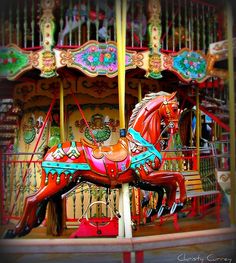 an old fashioned merry go round with horses