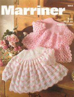 an image of a magazine cover with baby sweaters and hats on top of a dresser