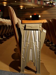 a chair that is sitting in front of some chairs