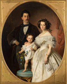 a portrait of a man and woman with a child