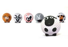 a group of golf balls with cartoon animals on them