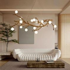 a living room filled with white furniture and lots of lights hanging from it's ceiling