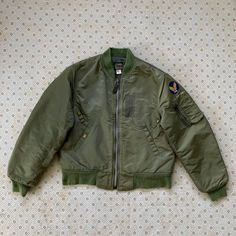 Brand: Type MA-1 Flight Jacket (All measurements in inches and were taken lying flat) ➡️Pit to pit: 23.5 ➡️Top to bottom: 25 ➡️Shoulder: 18 ➡️Sleeve: 25.5 ✍️Condition: 7/10 ✍️made by i spiewak and son  ✍️stain please refer the picture ✍️true vintage 80s ✍️Authentic made in usa B7 Military Style Long Sleeve Outerwear With Padded Collar, Fitted Streetwear Outerwear With Zip Fly, Fitted Military Outerwear With Pockets, Military Style Long Sleeve Outerwear With Zip Fly, Fitted Green Military Outerwear, Fitted Vintage Outdoor Outerwear, Vintage Fitted Long Sleeve Windbreaker, Vintage Fitted Windbreaker For Fall, Fitted Vintage Windbreaker For Fall