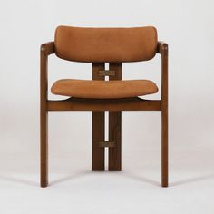 a wooden chair with a brown leather seat and back rest, on a white background