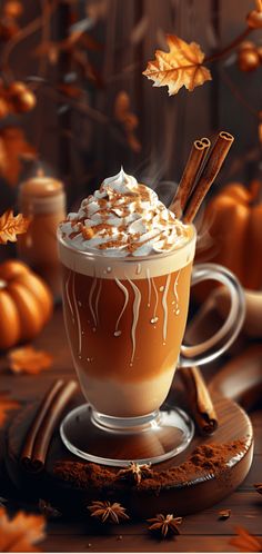 a cup of hot chocolate with whipped cream and cinnamon sticks