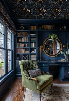 a green chair sitting in front of a desk with a mirror on top of it