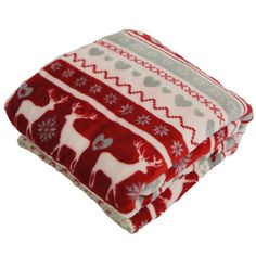 two red and white blankets sitting on top of each other, one with a deer design