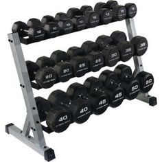 two rows of dumbbells in a rack on a white background with black numbers