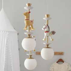 three lamps hanging from the ceiling in a room