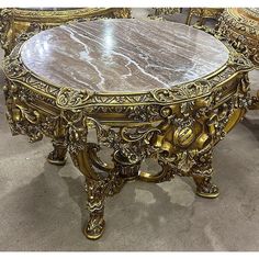 an ornately decorated table and chairs are on display