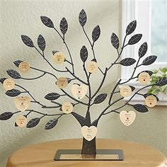 a wooden table with a tree that has hearts on it and leaves attached to the branches