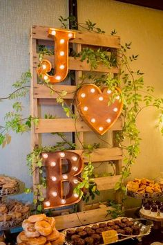 a table topped with lots of food next to a sign that says i love you