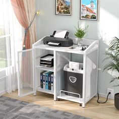 a computer desk with a printer on top of it