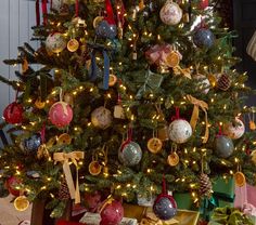 a decorated christmas tree with presents under it