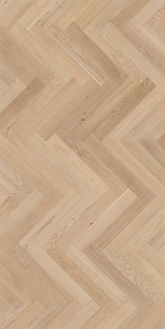 an image of wood flooring that looks like herringbones or chevron lines