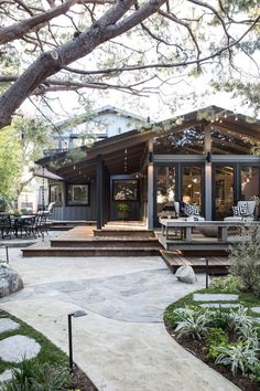 a house that is surrounded by trees and plants