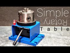 a machine that is sitting on top of a blue box with the words simple assembly table