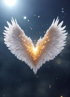 white angel wings with gold sparkles in the sky