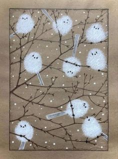 some white birds are sitting on branches in the snow