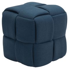 a blue cube ottoman sitting on top of a white floor