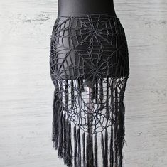 Black spider web fringe hip scarf is a unique and stylish piece, perfect for adding an edgy, gothic flair to your wardrobe. This versatile accessory can be used as a triangle dance overskirt, Crochet belly dance hip wrap, or even a gothic belt. Handmade with intricate cobweb crochet patterns, it brings a delicate yet bold look, ideal for exotic dance wear, burning man clothes or alternative fashion styles.                                   Crochet hip scarf fits for size M, L, XL length includin Crochet Belly Dance, Triangle Skirt, Gothic Belt, Scarf Fits, Rave Skirt, Skirt Crochet, Hip Scarf, Man Clothes, Exotic Dance