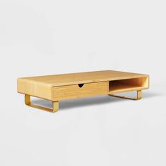 a wooden coffee table with one drawer open