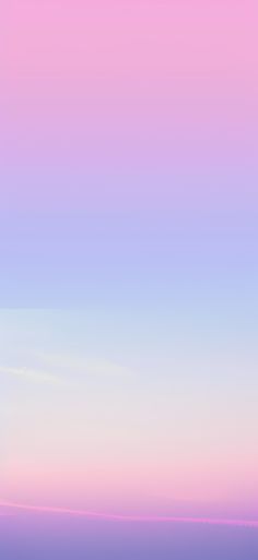 an airplane is flying in the sky with pink and blue hues on it's side