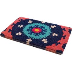 a blue, red and pink rug with an intricate design on the bottom half of it