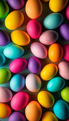 an array of colored eggs are shown in this image