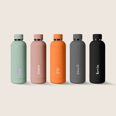 thermos bottles are lined up in different colors