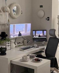 a computer desk with two monitors on it