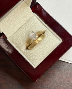 an open box with a ring in it